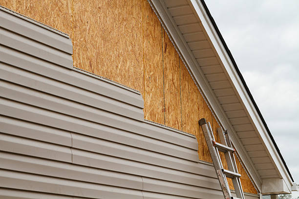 Professional Storm Damage Siding Repair technician working in Dillonvale, OH